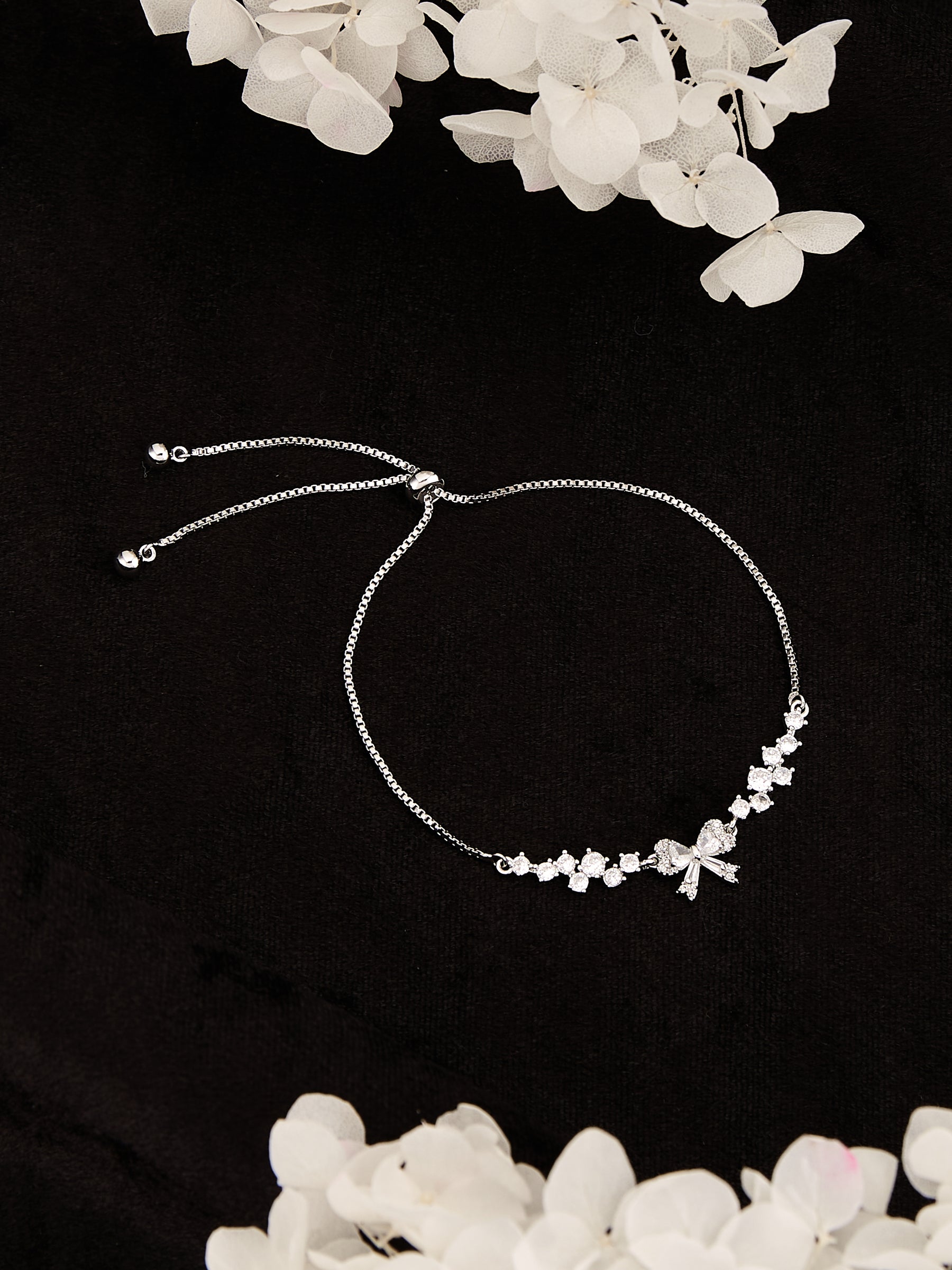 Latin Quarters Women's Adjustable Silver Bow Bracelet