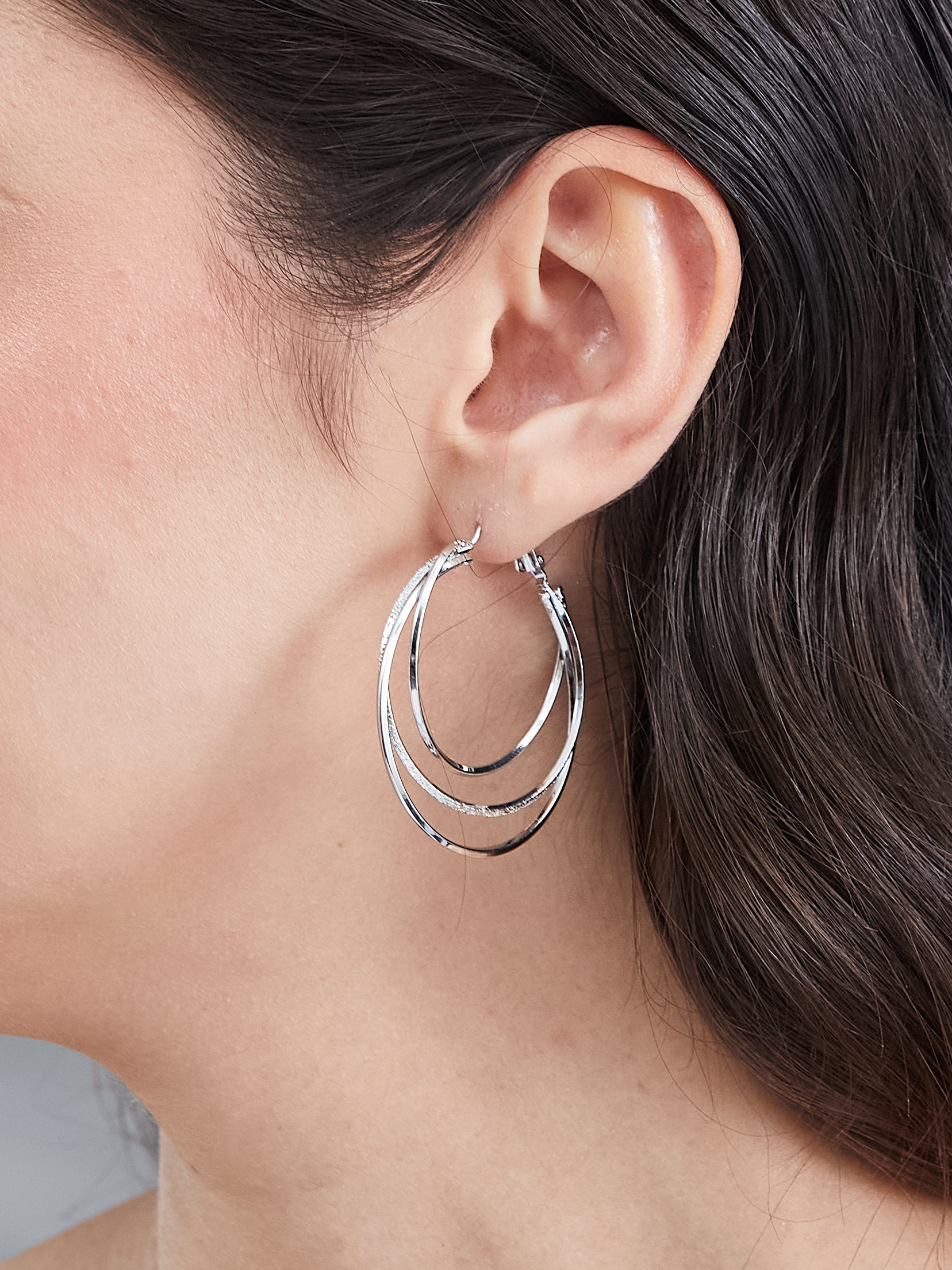 Latin Quarters Women's Triple Layered Silver Toned Hoop Earrings