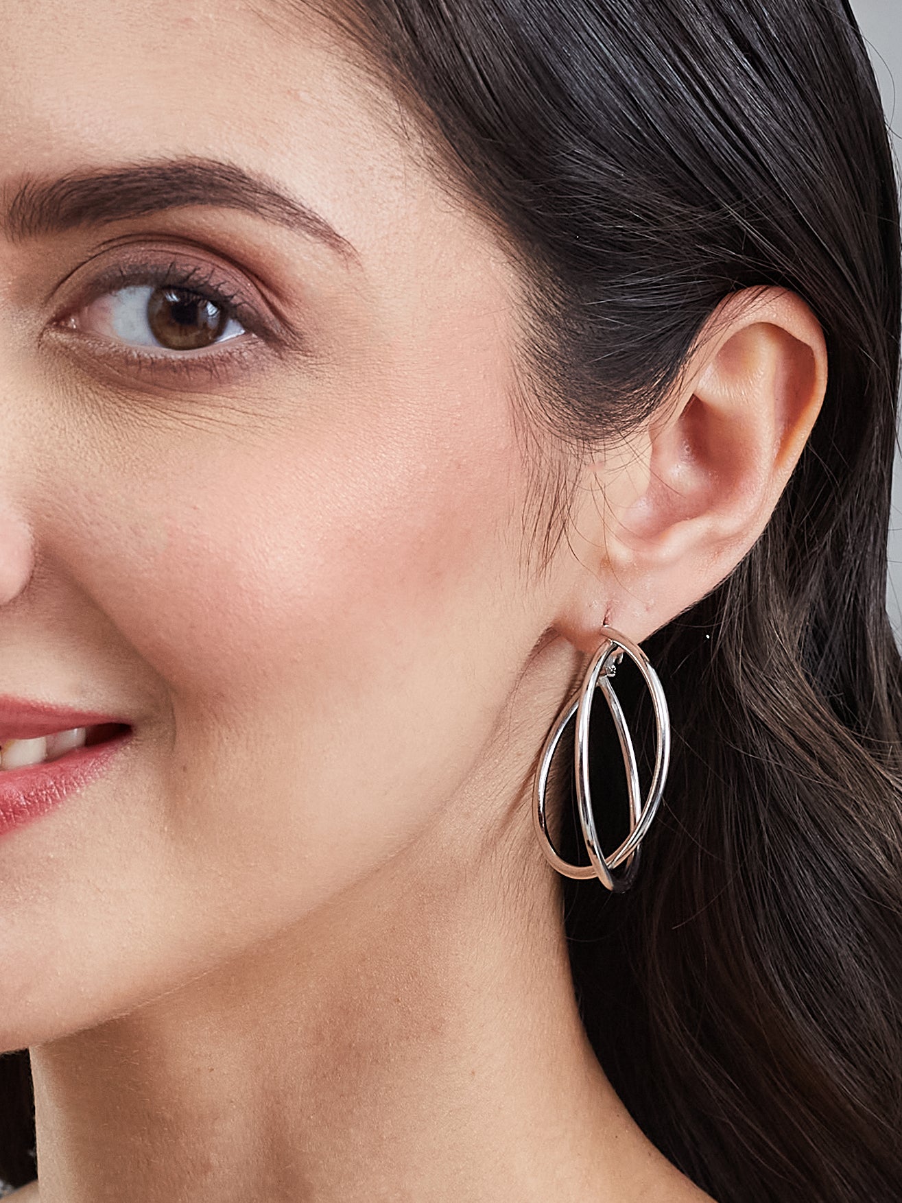 Latin Quarters Women's Silver Toned Interlocked Hoop Earrings