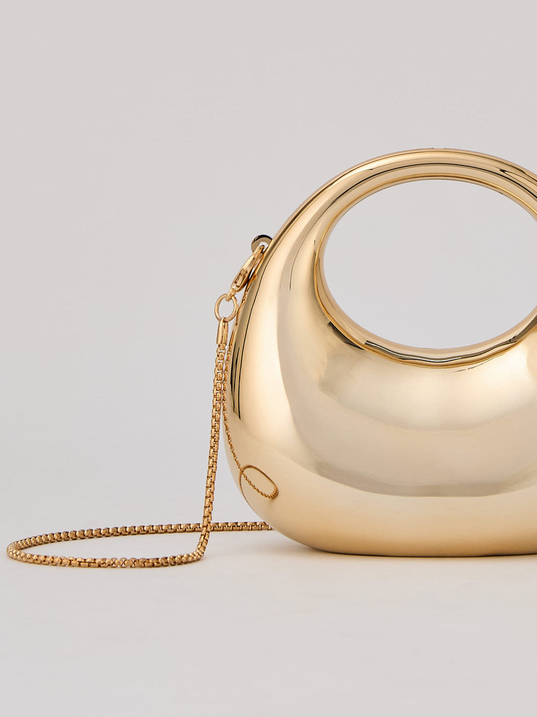 Latin Quarters Women's Metallic Golden Sculptural Cutout Clutch with Top Handle & Chain Strap