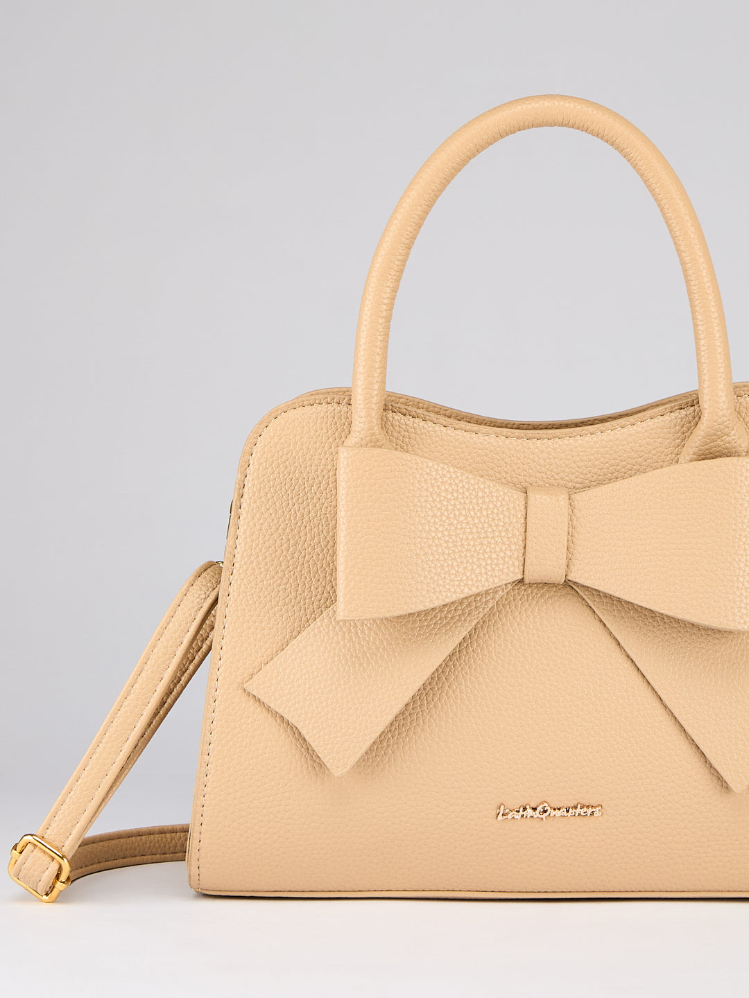Latin Quarters Women's Beige Bow Handbag with Crossbody Strap